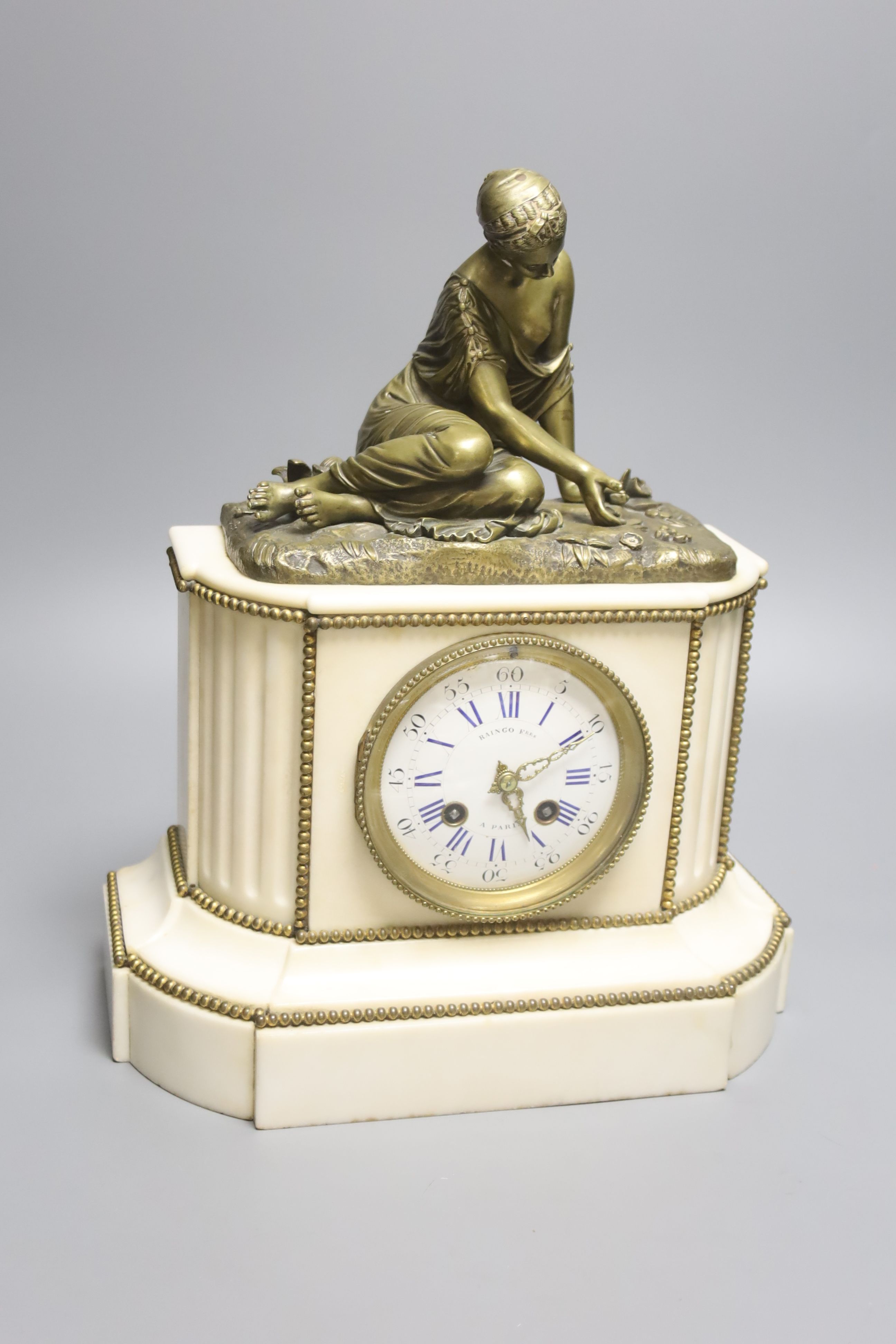 A 19th century French bronze and marble figural mantel clock, height 35cm